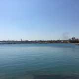 ...mentre all�orizzonte si profila lo skyline cittadino, con la torre del palazzo della Provincia che si innalza sugli edifici circostanti